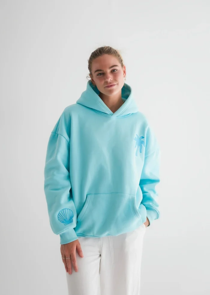 "Hawaii Hibiscus" Pink Palm Puff Hoodie in Aquamarine